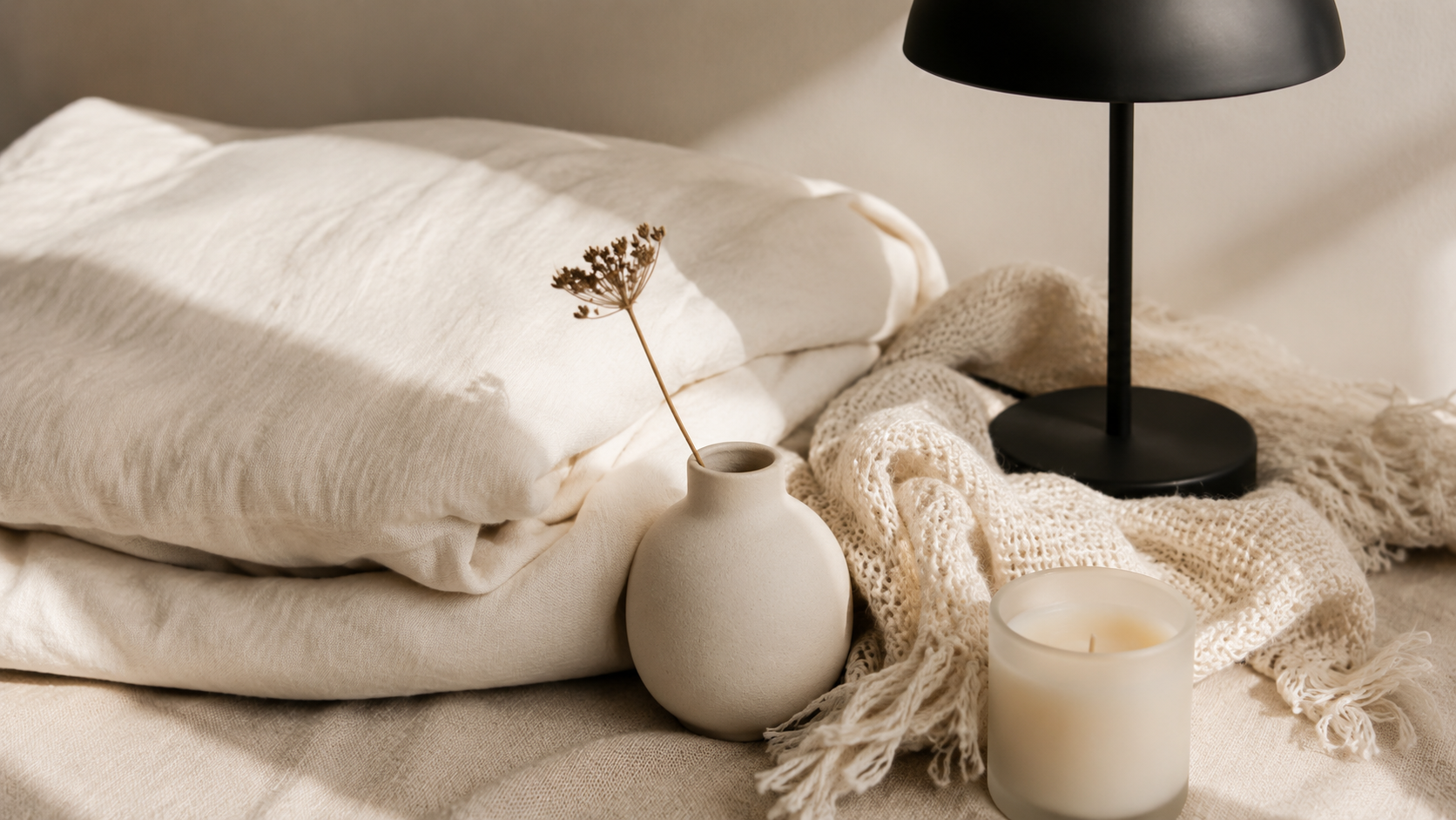 eight minimalist room design amazon finds including linen duvet, rattan mirror, ceramic vases and woven throw 2026