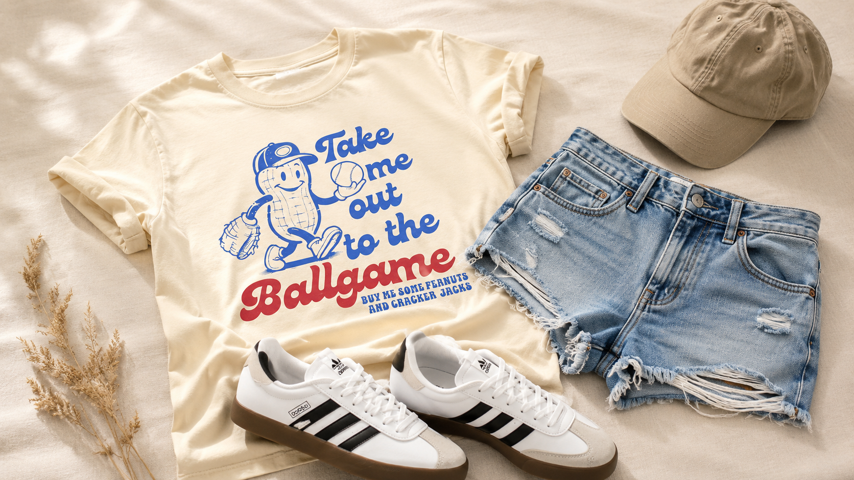 baseball game outfit flatlay — graphic tee, levi's denim shorts, adidas white sneakers — baseball game outfit ideas women amazon 2026