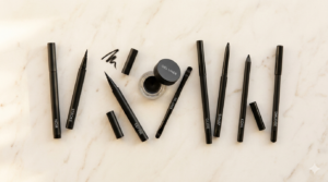 eight eyeliner products flatlay on cream surface — diy eyeliner looks amazon makeup 2026