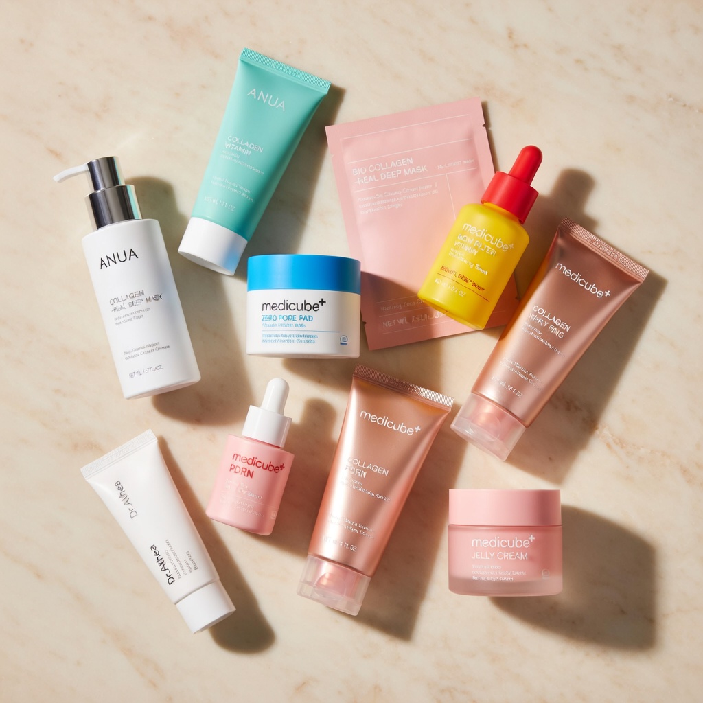 flatlay of korean skincare bestsellers including anua cleansing oil, medicube toner pads, biodance mask and beauty of joseon eye serum — korean skincare bestsellers 2026